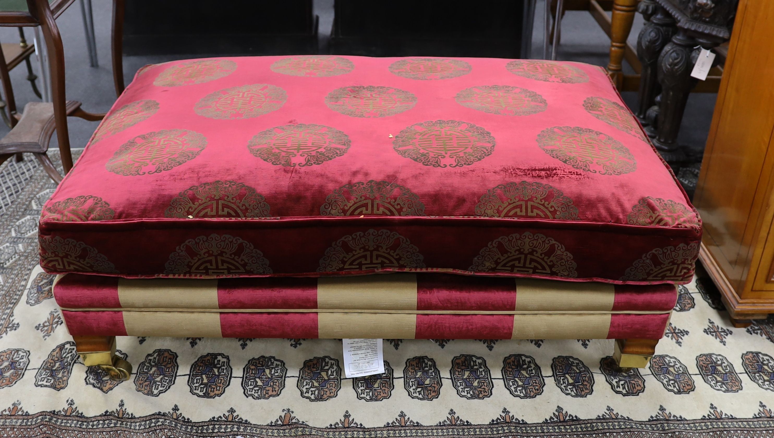 A large Duresta rectangular footstool upholstered in a Chinese style fabric, length 122cm, depth 84cm, height 40cm